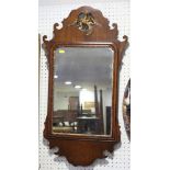 A walnut and gilt wall mirror of early Georgian design with Ho Ho bird crest, plate 11" x 17"