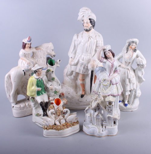 A Staffordshire figure, "The Lion Slayer", 17 1/2" high, and a number of Staffordshire figures (a/