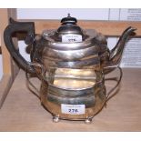 A silver teapot of compressed melon form, with ebonised knop and handle and presentation