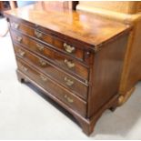 A largely George III figured walnut and banded fold-over top desk, fitted four long graduated