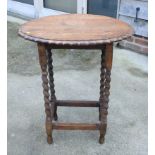 A walnut square top occasional table, on turned supports united by an undertier, 15" wide,