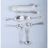 A pair of Victorian cast silver sugar tongs, a pair of Georgian silver mustard spoons and various