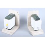 A pair of Art Deco marble and other hardstone bookends, 7" high