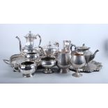 A silver plated four-piece teaset, a gallery tray and other plated items, in a brown suitcase
