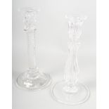 Two 19th century moulded clear glass candlesticks, one with an air twist stem, the other with a