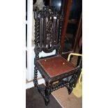 A late 19th century carved oak hall chair, in the Black Forrest style, with barley twist