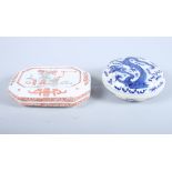 A Chinese porcelain blue and white powder box and cover, decorated with a flying dragon and