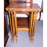 A nest of three Sheraton Revival painted satinwood occasional tables, the tops of each decorated