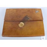 A brown leather writing folder, retailed by Edwards & Sons, Regent Street, with green leather