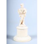A 19th century Dieppe carving of a gentleman with geese under his arms, on plinth base, 4 1/2" high