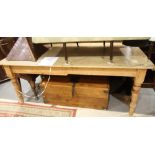 A 19th century waxed pine plank top kitchen table, fitted one drawer, on turned supports, top 81"