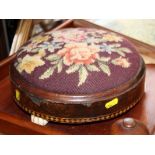 A Victorian circular footstool with marquetry decorated walnut frame, upholstered in a cross stitch
