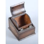 A 1920s/1930s oak cigarette box with cylindrical lift-up compartment