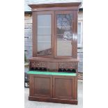 A Victorian secretaire bookcase, the upper section enclosed glazed panel doors over fitted writing