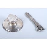 A silver cigar cutter, Chester 1899, together with a silver Capstan inkwell (liner missing),