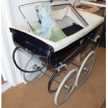 A blue Silver Cross pram