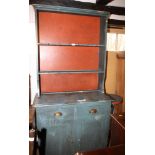 A 19th century blue painted pine dresser with open plate rack over two drawers and cupboards, on