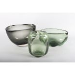 An Whitefriars James Hogan oviform green studio glass vase, 10" wide, a similar grey glass vase