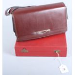 A lady's mid 20th century Orloff evening bag, a 20th century leather covered Cartier box and a