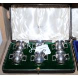 A cased set of six silver two-handled liqueur cups, Mappin & Webb, Birmingham 1939, 1 1/2" high, 4.