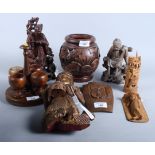 Two Chinese carved hardwood deities, a sandalwood elephant, a similar sleeping Buddha and other