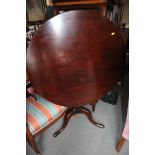 An 18th century mahogany circular tilt top occasional table, on tripod splay supports, 24" dia