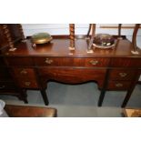 A 19th century mahogany sideboard, fitted central drawer flanked cellarette and two further drawers,