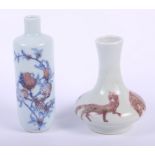 A Chinese porcelain bottle shaped vase, decorated peaches on underglaze blue and red, six