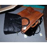 A brown leather briefcase and three lady's handbags
