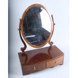 A George III design mahogany dressing table mirror, fitted two drawers, on shaped bracket feet, 17