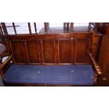 An 18th century Hanseatic pine, fruitwood and beech settle with box seat and five panel back, on