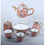 An 18th century Chinese export teaset comprising a teapot, three cups, a jug, a slop bowl and a