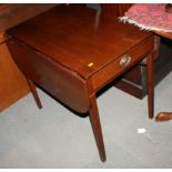 An early 19th century mahogany Pembroke table, fitted real and dummy drawers, on square tapered