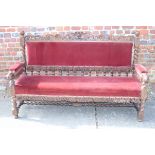 An Empire Loyalist design bench settee, upholstered in a red velvet