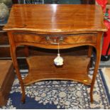 A French walnut serpentine front two-tier occasional table, fitted one drawer, on cabriole supports,