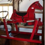A child's American red painted wooden "Wonder Horse", on sprung stand, 32" long