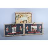 A Victorian printed brick jigsaw puzzle with six different images and two later jigsaw puzzles,