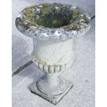 A carved stone garden planter with lobed decoration, 29" high