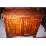 A 19th century mahogany and banded side cupboard with fitted interior enclosed two doors, on bracket