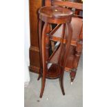 An Edwardian line inlaid mahogany plant stand and a folding three-tier cake stand