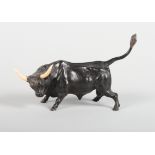 A bronze figure of a bull with ivory horns, 7" long, a bronze figure of an elephant and rider, and