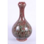 A 19th century Chinese porcelain garlic vase with mottled sang de boeuf glaze, 9 1/2" high