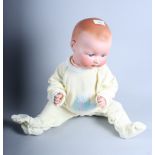 An Armand Marseille bisque head doll with sleeping eyes, open mouth and jointed composition body,