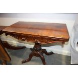 A 19th century rosewood fold-over top card table with red baize playing surface, on turned column