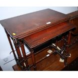 A nest of three mahogany tables with leather inlay, on turned supports