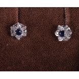 A pair of sapphire and diamond ear studs