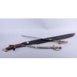 A Lord of the Rings replica "Hadhafang" sword, blade 29" long, in leather scabbard, and two brass