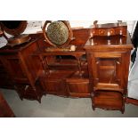 A 19th century rosewood inverse breakfront sideboard, fitted two glazed cupboards with central