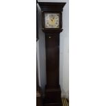 An oak long case clock with eight-day, three-train strike chiming movement and 8 1/2" brass dial,