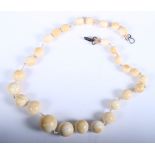 An ivory graduated bead necklace, 22" long, 85.1g